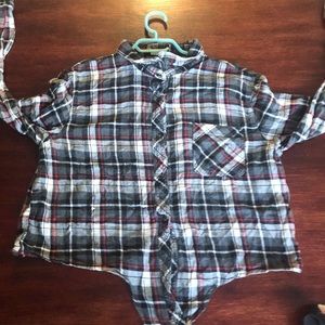 A cropped flannel, ties at front